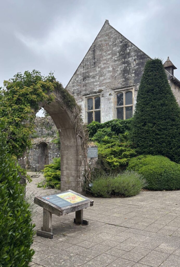 Picture of the abbey and a gateway with ivy